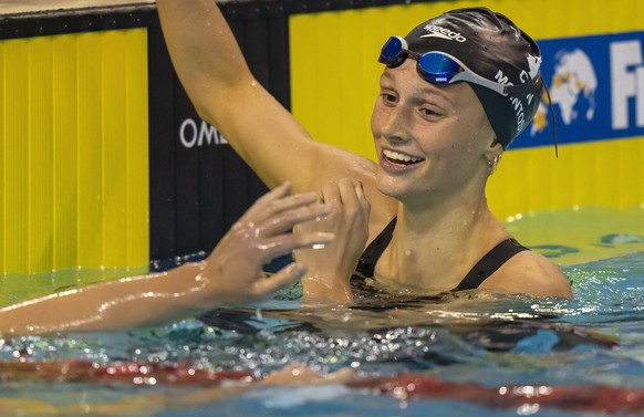 Summer McIntosh, right, of Canada is congratulated by Katie Ledecky, left, of the United States, after winning the women&#039;s 400m freestyle in World Junior Record time at the FINA Swimming World Cu ...