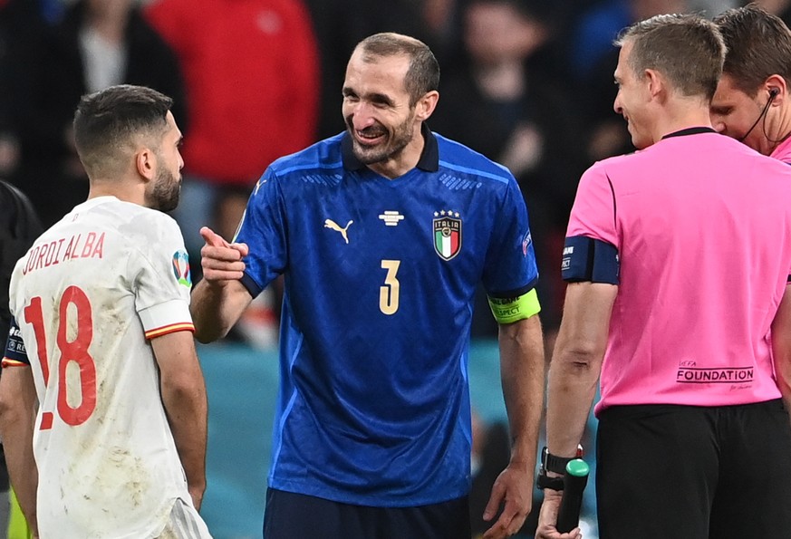 epa09327264 Giorgio Chiellini of Italy (C) reacts with Jordi Alba of Spain prior the penalty shoot out during the UEFA EURO 2020 semi final between Italy and Spain in London, Britain, 06 July 2021. EP ...
