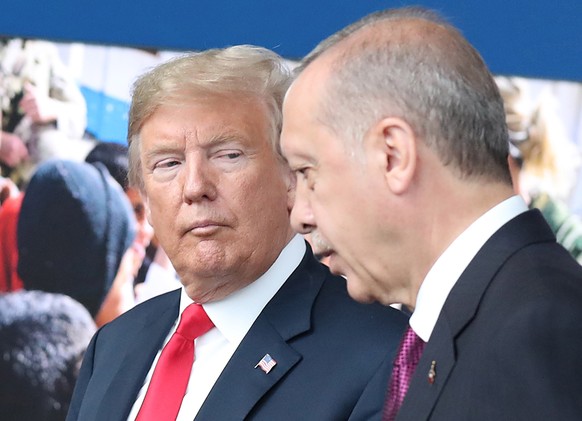 epa06943382 (FILE) - US President Donald J. Trump (L) looks at Turkey&#039;s President Recep Tayyip Erdogan (R) at NATO headquarters in Brussels, Belgium, 11 July 2018 (reissued 11 August 2018). Turki ...