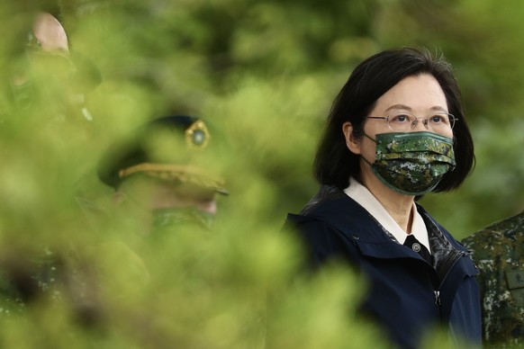 epa09698879 Taiwan President Tsai Ing-wen reviews military personnel during her visit at a military base in Taitung, Taiwan, 21 January 2022. President Tsai Ing-wen pledged to strengthen Taiwan?s defe ...