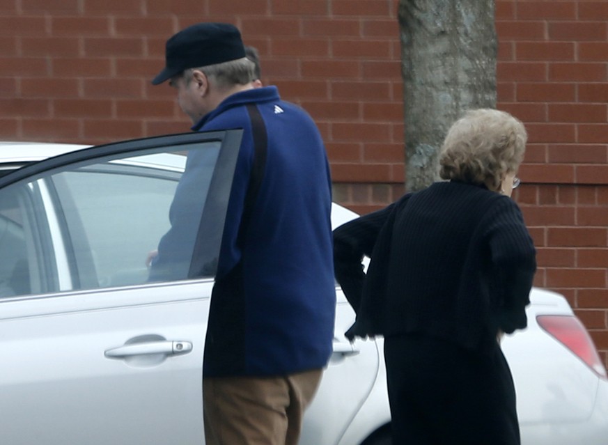 FILE - In this March 19, 2015 file photo, John Hinckley Jr., left, gets into his mother&#039;s car in front of a recreation center in Williamsburg, Va. The man who shot President Ronald Reagan is sche ...