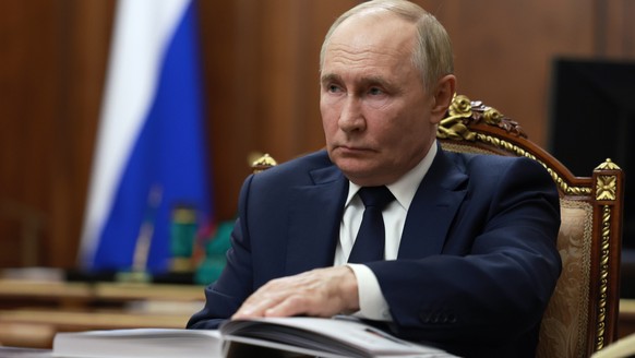 epa11509616 Russian President Vladimir Putin meets with Rostec State Corporation CEO Sergei Chemezov (not pictured) at the Kremlin in Moscow, Russia, 30 July 2024. EPA/GAVRIIL GRIGOROV/SPUTNIK/KREMLIN ...
