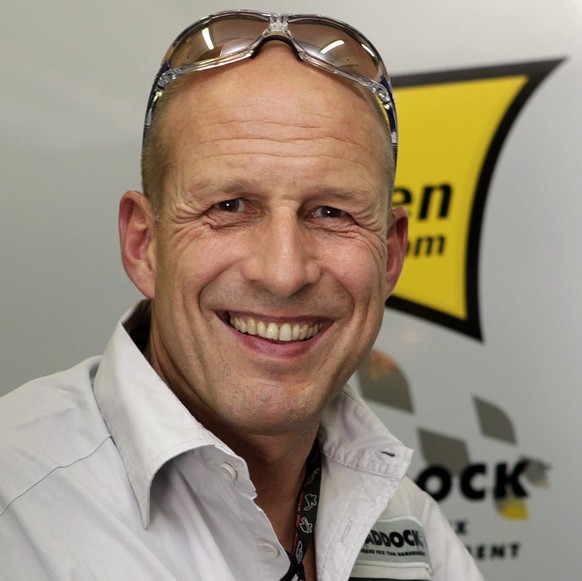 Swiss Daniel Epp, owner of Swiss Moto2 motorcycle pilot Thomas Luethi&#039;s Interwetten-Paddock team, smiles in his team box, after the second free practice to Sunday&#039;s Grand Prix de France, in  ...