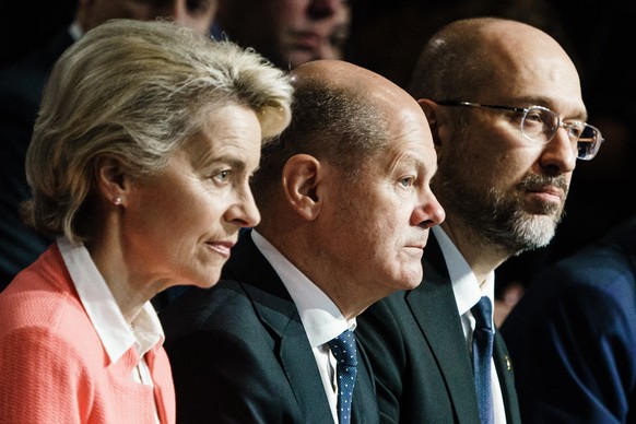 epa10264968 (L-R) European Commission President Ursula von der Leyen, German Chancellor Olaf Scholz and Ukrainian prime minister Denys Schmyhal sit next to each other during the opening of the Interna ...
