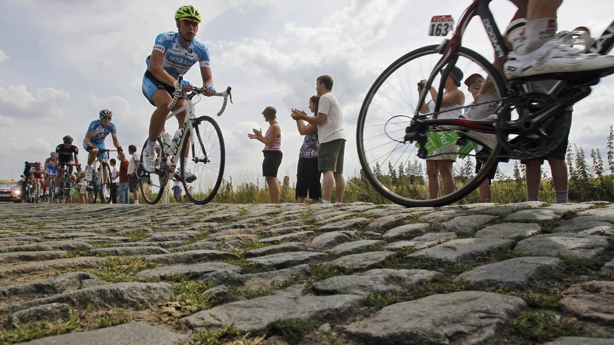In this Tuesday July 6, 2010 file photo riders pass a cobblestone section during the third stage of the Tour de France cycling race over 213 kilometers (132.4 miles) with start in Wanze, Belgium and f ...