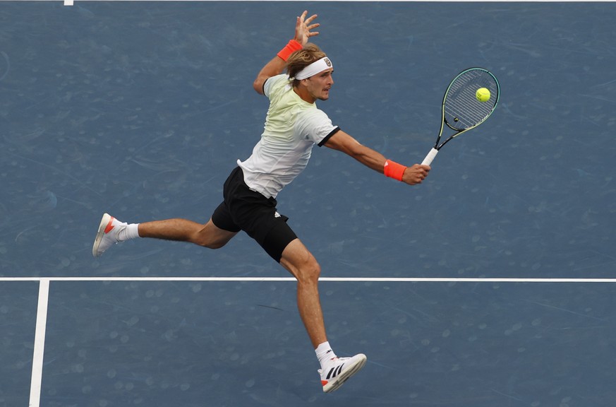 epaselect epa09379285 Alexander Zverev of Germany in action against Novak Djokovic of Serbia during the Men&#039;s Singles Semifinal Tennis events of the Tokyo 2020 Olympic Games at the Ariake Coliseu ...