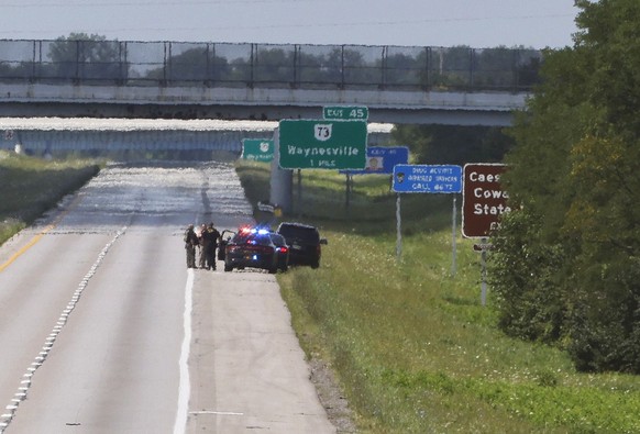 Waves of heat radiate off Interstate 71 in Clinton County near Cincinnati, Ohio, which was closed during a standoff Thursday, Aug. 11, 2022, with an armed man wearing body armor who tried to breach se ...