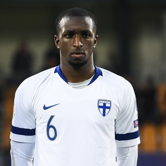 Finland&#039;s Glen Kamara, Teemu Pukki and Jere Uronen, from left, sing the national anthem, during the UEFA Euro 2020 Qualifying, Group J soccer match between Liechtenstein and Finland, on Tuesday,  ...