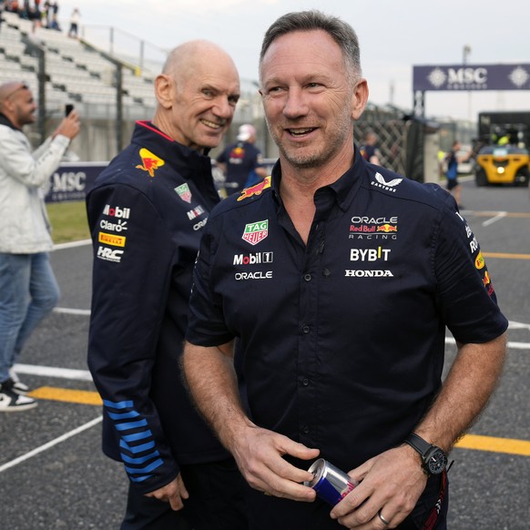 epa11263667 Red Bull Racing team principal Christian Horner (R) and chief technical officer Adrian Newey smile on the track after a team shot after the Formula One Japanese Grand Prix at the Suzuka In ...