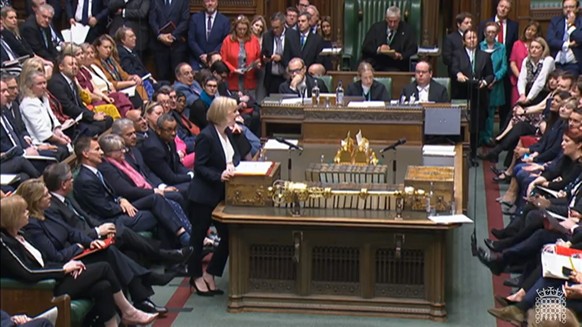 epa10252153 A grab from a handout video made available by the UK Parliamentary Recording Unit shows British Prime Minister Liz Truss (C), answer during the Prime Minister&#039;s Question (PMQs) at the ...