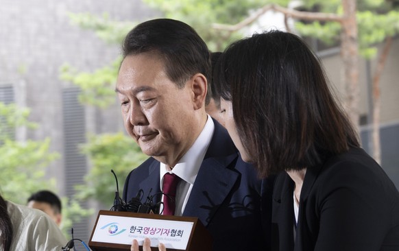 epa12652734 (FILE) - Former President Yoon Suk Yeol arrives for questioning over charges related to the 03 December 2024 martial law imposition at the special prosecutor's office in Seoul, South  ...