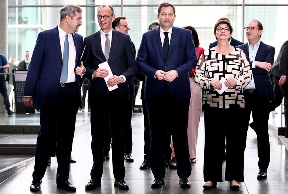 epa12020320 (L-R) State Premier of Bavaria Markus Soeder, Chairman of the Christian Democratic Union (CDU) party and faction Friedrich Merz, Social Democratic Party (SPD) co-chairman Lars Klingbeil an ...