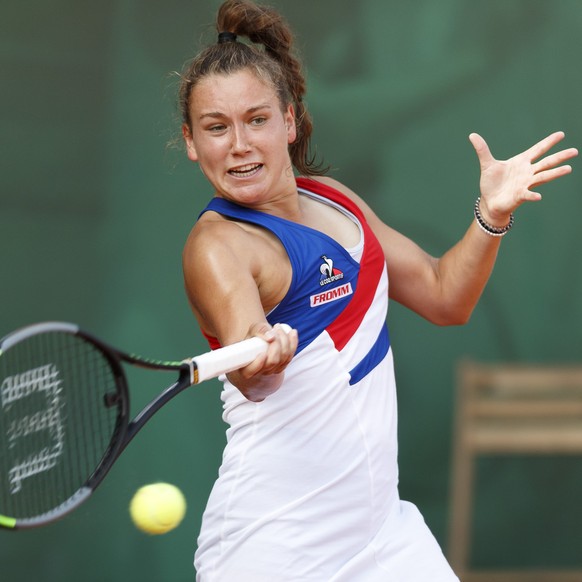 Ylena In-Albon from Switzerland, returns a ball to Lucia Bronzetti from Italy, during the qualification match, at the WTA International Ladies open Lausanne tournament, in Lausanne, Switzerland, Monda ...