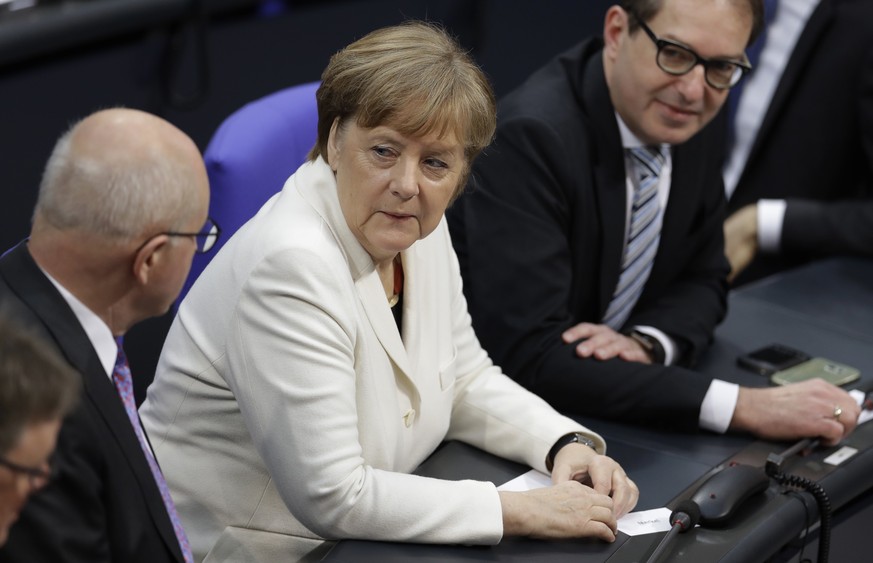 German Chancellor Angela Merkel sits between Christian Democratic faction leader Volker Kauder, left, and Alexander Dobrindt when Germany&#039;s parliament Bundestag meets to elect Angela Merkel for a ...