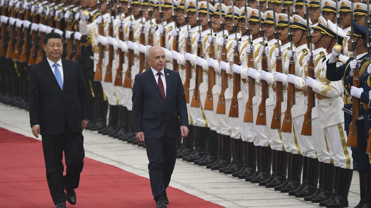 Switzerland's President Ueli Maurer, right, and China's President Xi Jinping review an honor guard during a welcome ceremony at the Great Hall of the People, Monday, April 29, 2019, in Bejin ...