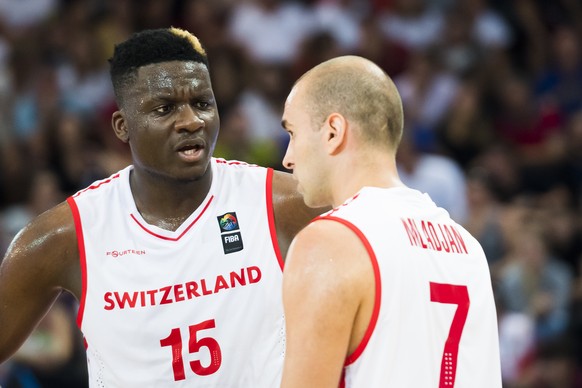 Switzerland?s Clint Capela, left, talks with Switzerland?s Dusan Mladjan, right, during the FIBA Eurobasket 2021 pre-qualifiers match between Switzerland and Portugal in Fribourg, Switzerland, Saturda ...