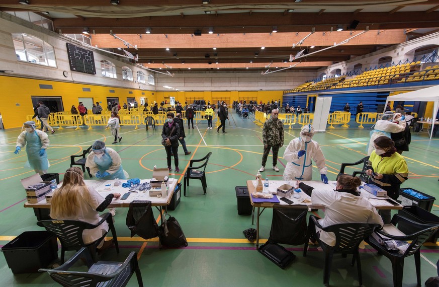 People queue during a massive test control for coronavirus at Palma de Mallorca, Balearics Islands, Spain on 28 December 2020. Palma de Mallorca records 621 cases for each 100,000 inhabitants and beco ...