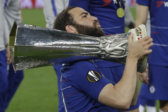 Chelsea's Gonzalo Higuain celebrates with the trophy after winning the Europa League Final soccer match between Arsenal and Chelsea at the Olympic stadium in Baku, Azerbaijan, Wednesday, May 29, 2019. ...