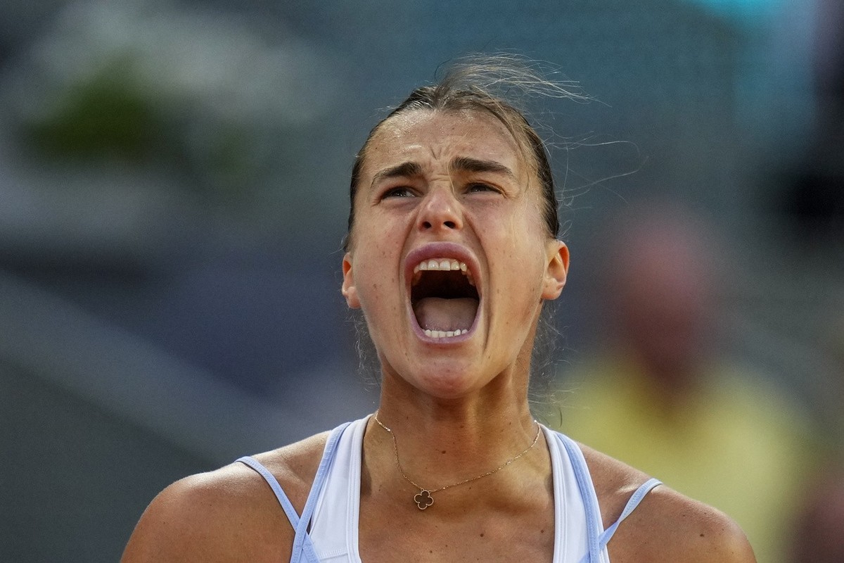 Belarus' Aryna Sabalenka celebrates a point against Iga Swiatek of Poland during their women's final match at the Madrid Open tennis tournament in Madrid, Spain, Saturday, May 6, 2023. (AP P ...