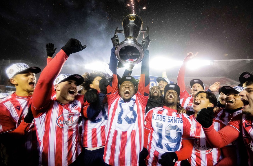 November 9, 2025, Ottawa, On, Canada: Atletico Ottawa s Ballou Tabla (13) raises the North Star Cup following Atletico OttawaöÄÃ s victory over Cavalry FC in extra time during the Canadian Premier Lea ...