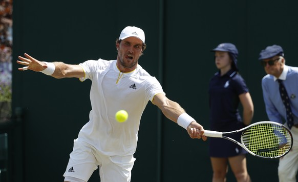 Germany&#039;s Mischa Zverev plays a return against Kazakstan&#039;s Mikhail Kukushkin during their Men&#039;s Singles Match on day four at the Wimbledon Tennis Championships in London Thursday, July  ...