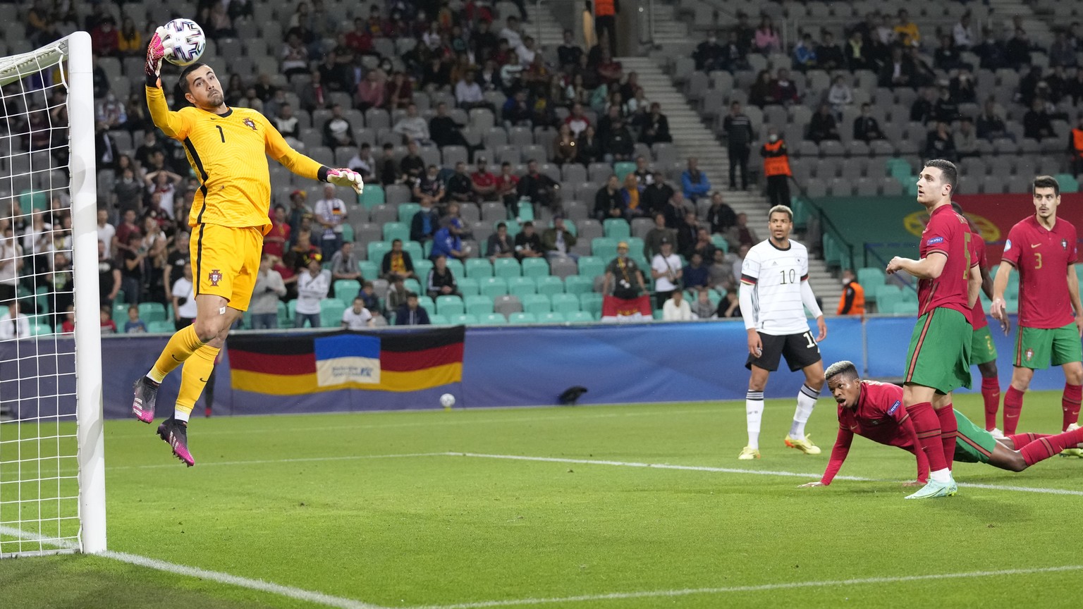 Portugal goalkeeper Diogo Costa makes a save during the Euro U21 final soccer match between Germany and Portugal at the Stozice stadium in Ljubljana, Slovenia, Sunday, June 6, 2021. (AP Photo/Darko Ba ...