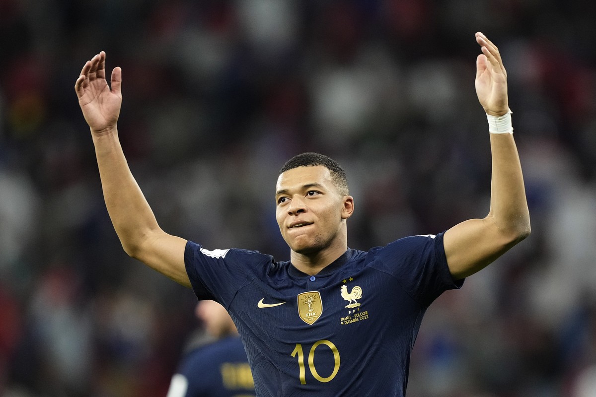 France's Kylian Mbappe celebrates scoring his side's third goal during the World Cup round of 16 soccer match between France and Poland, at the Al Thumama Stadium in Doha, Qatar, Sunday, Dec ...
