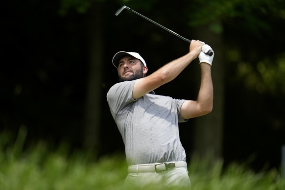 Scottie Scheffler watches his tee shot on the third hole during the third round of the PGA Championship golf tournament at the Valhalla Golf Club, Saturday, May 18, 2024, in Louisville, Ky. (AP Photo/ ...