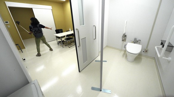 A journalist films a processing room of the Doping Control Station at the Tokyo 2020 Olympic and Paralympic Village during a press tour Sunday, June 20, 2021, in Tokyo. (AP Photo/Eugene Hoshiko)