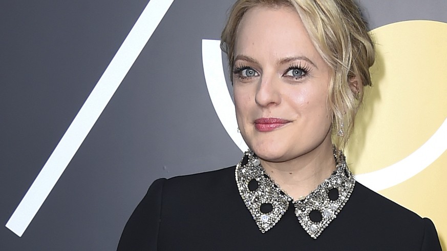 Elisabeth Moss arrives at the 75th annual Golden Globe Awards at the Beverly Hilton Hotel on Sunday, Jan. 7, 2018, in Beverly Hills, Calif. (Photo by Jordan Strauss/Invision/AP)