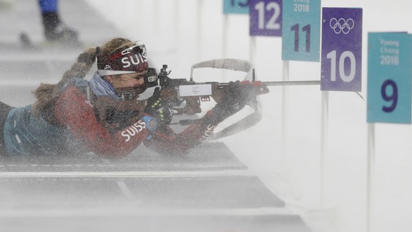 Switzerland&#039;s Irene Cadurisch tries to aim her rifle amidst a gust of snow and wind during a training session at the shooting range of the Alpensia Biathlon center at the 2018 Winter Olympics in  ...