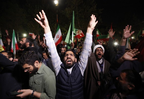 epa11277478 Iranians celebrate after Iran launched drone attacks against Israel; in front of the British embassy in Tehran, Iran, 14 April 2024. Iran&#039;s Islamic Revolutionary Guards Corps (IRGC) l ...