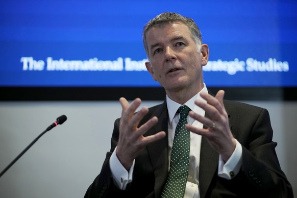 FILE - Richard Moore, the Chief of Britain&#039;s Secret Intelligence Service, also known as MI6, answers questions at the International Institute for Strategic Studies, in London, on Nov. 30, 2021. T ...
