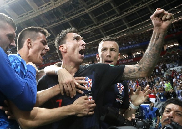 Croatia&#039;s Mario Mandzukic, center, celebrates after scoring his side&#039;s second goal during the semifinal match between Croatia and England at the 2018 soccer World Cup in the Luzhniki Stadium ...