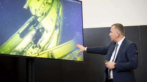 Rene Arikas, director of the Estonian Accident Investigation Board points as he speaks during a joint news conference with Jonas Backstrand, deputy Director of the Swedish Accident Investigation Board ...