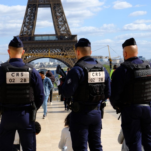Security Around Trocadero - Paris French police officers guard the Trocadero esplanade near the Eiffel Tower. Security has been stepped up throughout Paris in preparation for the Paris 2024 Olympics i ...