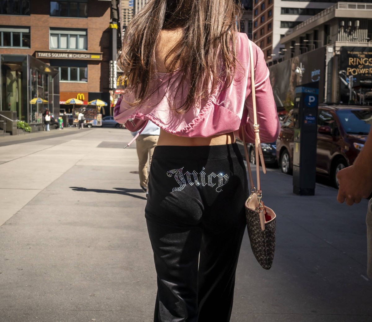 Juicy Couture blast from the past in New York A teen wearing Juicy Couture in Midtown Manhattan in New York on Sunday, September 8, 2024. Primarily associated with velour track suits, Juicy Couture wa ...