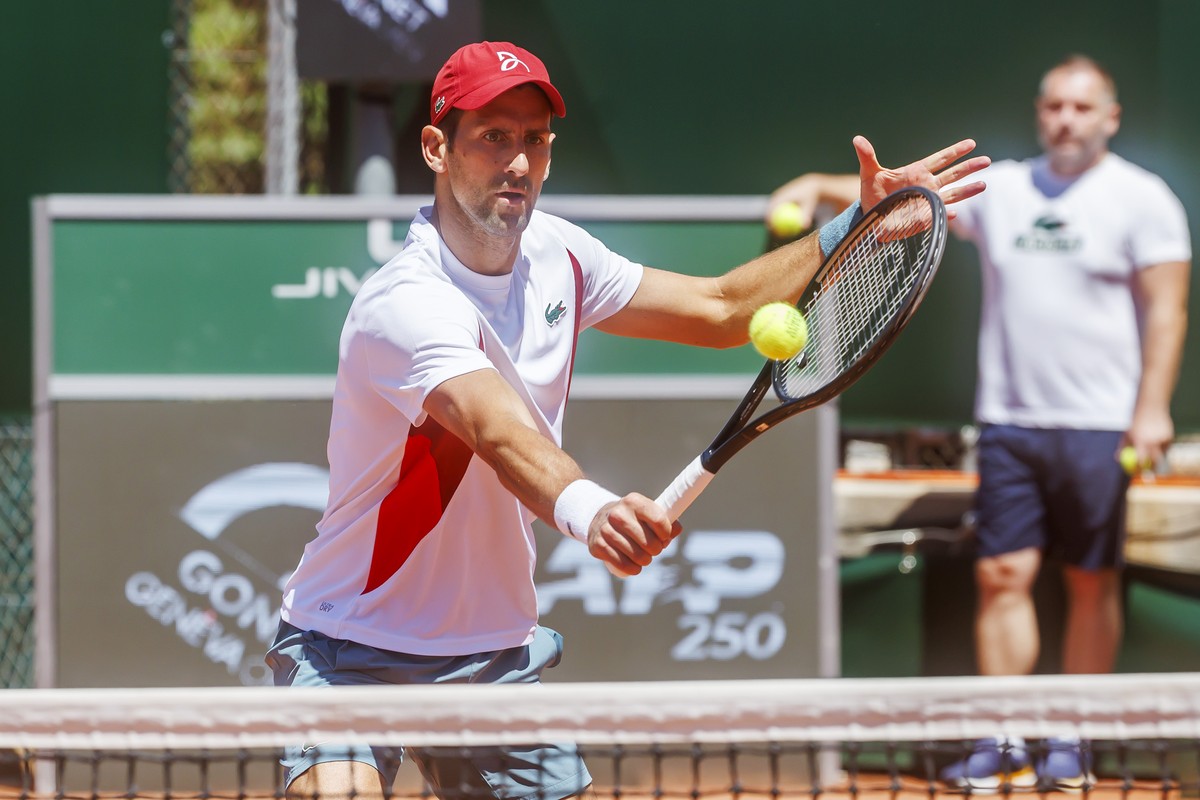 Novak Djokovic, of Serbia, returns a ball during a training session, at the ATP 250 Geneva Open tournament in Geneva, Switzerland, Tuesday, May 21, 2024. (KEYSTONE/Salvatore Di Nolfi)