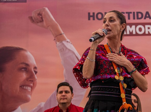 epa10993489 The official presidential candidate Claudia Sheinbaum delivers a speech during a meeting with the Mayan, Tzotzil, and Tzeltal indigenous peoples in Tenejapa, Mexico, 24 November 2023. Shei ...