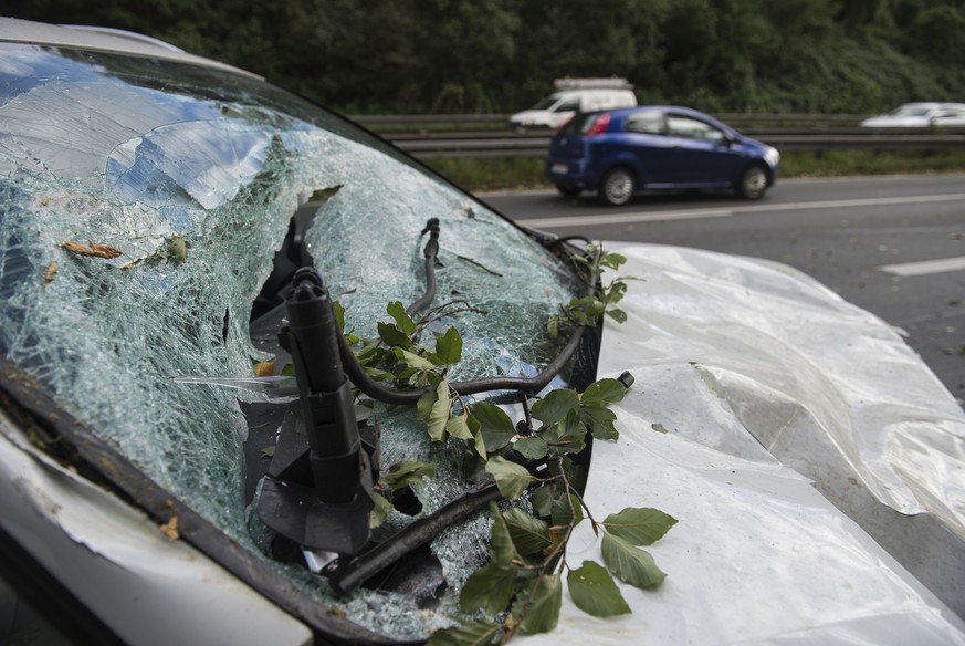 A damaged car is parked in Hannover, Germany, Thursday, Oct. 5, 2017. Storm Xavier caused restrictions in the railway and motor traffic in northern Germany. (Silas Stein/dpa via AP)