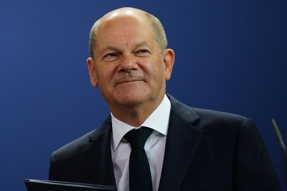 epa10127110 German Chancellor Olaf Scholz leaves after delivering a statement at the chancellery in Berlin, Germany, 18 August 2022. German Chancellor Olaf Scholz announced to lower the VAT on gas con ...