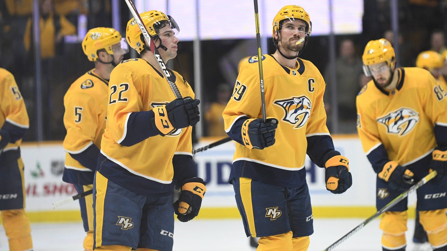 December 11, 2018; Nashville Predators left wing Kevin Fiala (22) and defenseman Roman Josi (59) salute too the crowd after the win against the Ottawa Senators during the third period between the Otta ...