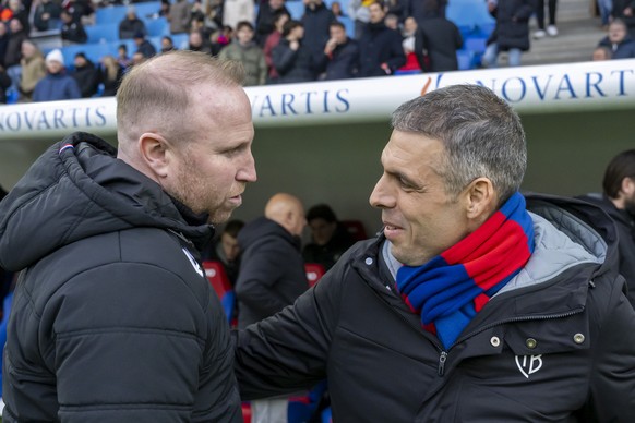 ARCHIV - LUDOVIC MAGNIN NEUER TRAINER FC BASEL - Cheftrainer Ludovic Magnin (LS), links, und Cheftrainer Fabio Celestini (FCB), rechts, begruessen sich vor dem Fussball Meisterschaftsspiel der Regular ...