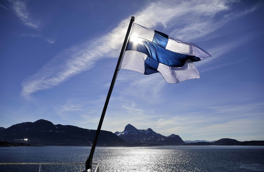 FILE - In this Saturday, July 29, 2017 file photo, Finland&#039;s flag flies aboard the Finnish icebreaker MSV Nordica as it arrives into Nuuk, Greenland. A nationwide experiment with basic income in  ...