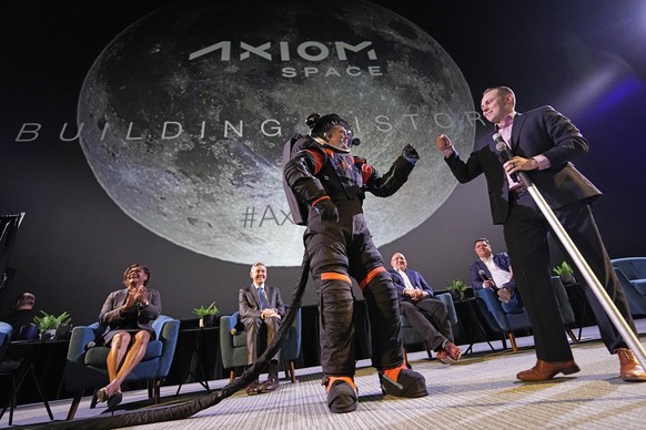 CORRECTS ID AT RIGH TO RUSSELL RALSTON, NOT MARK GREELEY - Axiom Space chief engineer Jim Stein, left, bumps fists with deputy manager for extravehicular activity Russell Ralston while demonstrating a ...