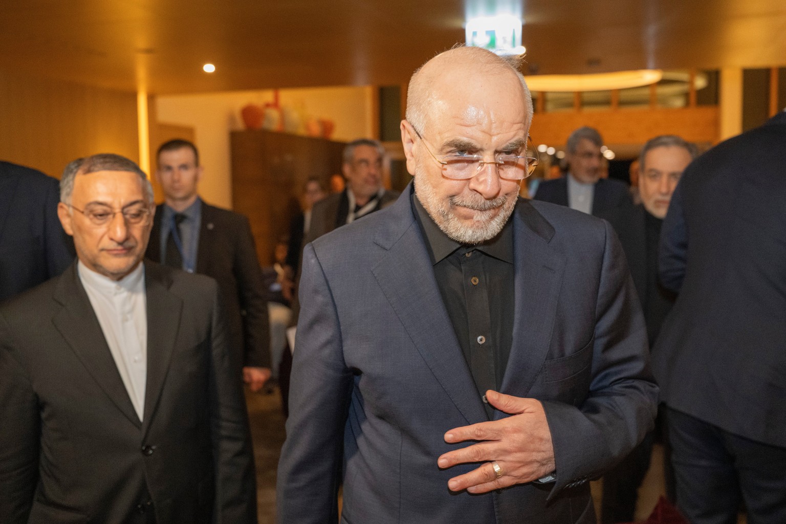 Speaker of the Islamic Parliament of Iran Mohammed Bagher Ghalibaf, center, arrives at the Buergenstock resort in Obbuergen, near Lucerne, Switzerland, early Sunday, June 21, 2026. (Urs Flueeler/Keyst ...