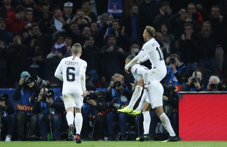 PSG forward Neymar, right, is carried by PSG forward Kylian Mbappe after scoring his side&#039;s second goal during a Champions League Group C soccer match between Paris Saint Germain and Liverpool at ...