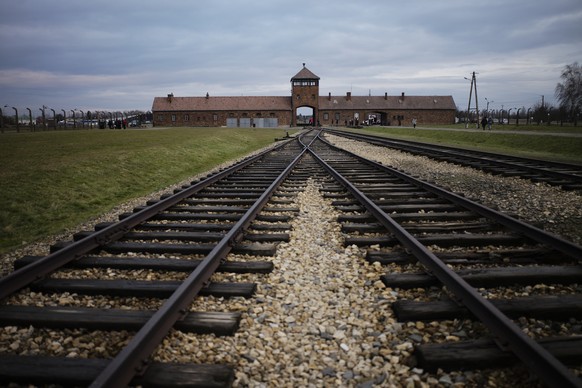 FILE - The railway tracks where people arrived to be directed to the gas chambers inside the former Nazi death camp of Auschwitz Birkenau, or Auschwitz II, are pictured in Oswiecim, Poland, on Dec. 7, ...