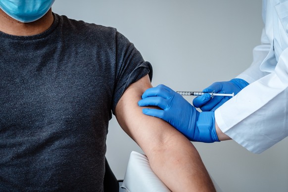 epa08814067 An undated handout picture made available by the German pharmaceutical company Biontec shows the dosing of BNT162b2, the mRNA-based vaccine candidate against COVID-19, during the clinical  ...