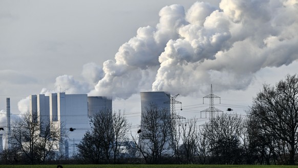 FILE - In this Monday, Jan. 13, 2020 file photo the RWE Niederaussem lignite-fired power station steams in Bergheim, Germany. Germany is forecast to record its biggest rise in greenhouse gas emissions ...